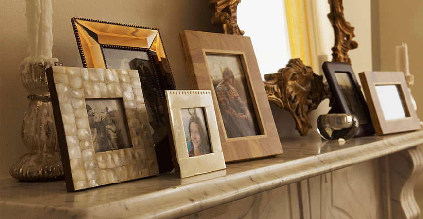 Fireplace Mantel With Framed Pictures