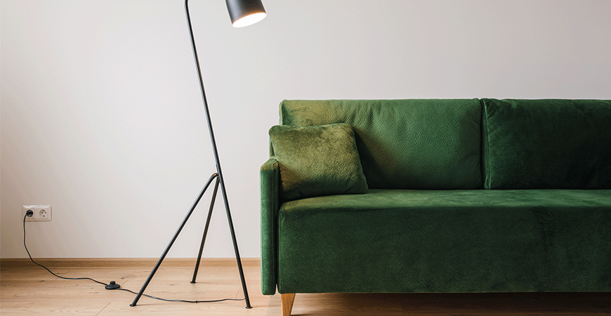 Green sofa with pillow